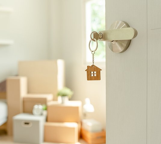 Key in the lock of a New Real Estate purchase