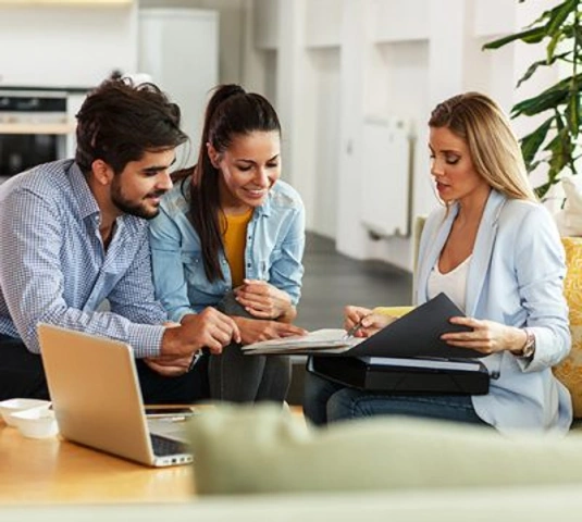 Coupling sitting down with a Real Estate agent