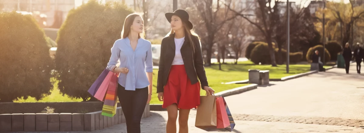 Two girls walking while shopping the streets of St. Petersburg fl